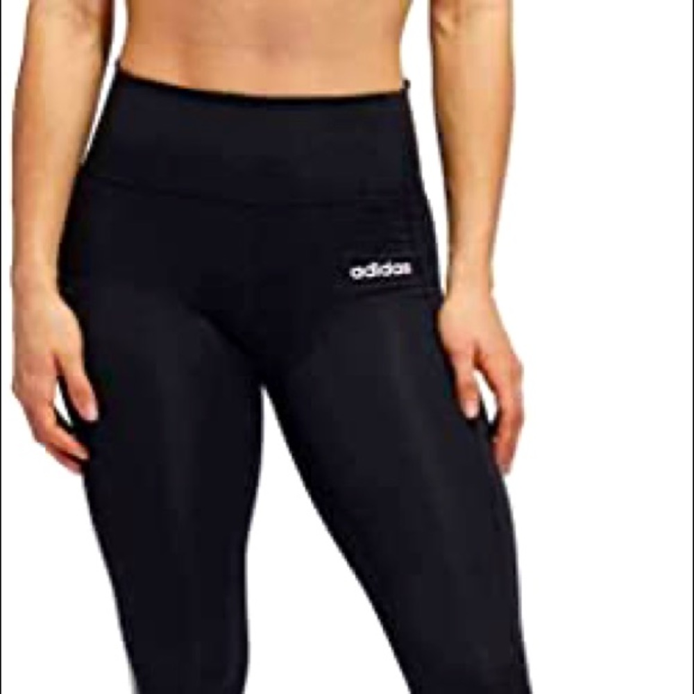 Women’s size small adidas leggings with white stripe halfway down the leg.